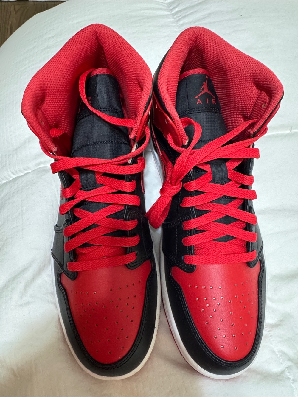 Men’s Nike Jordan One Mid’s High-Top Sneakers in Black and Red